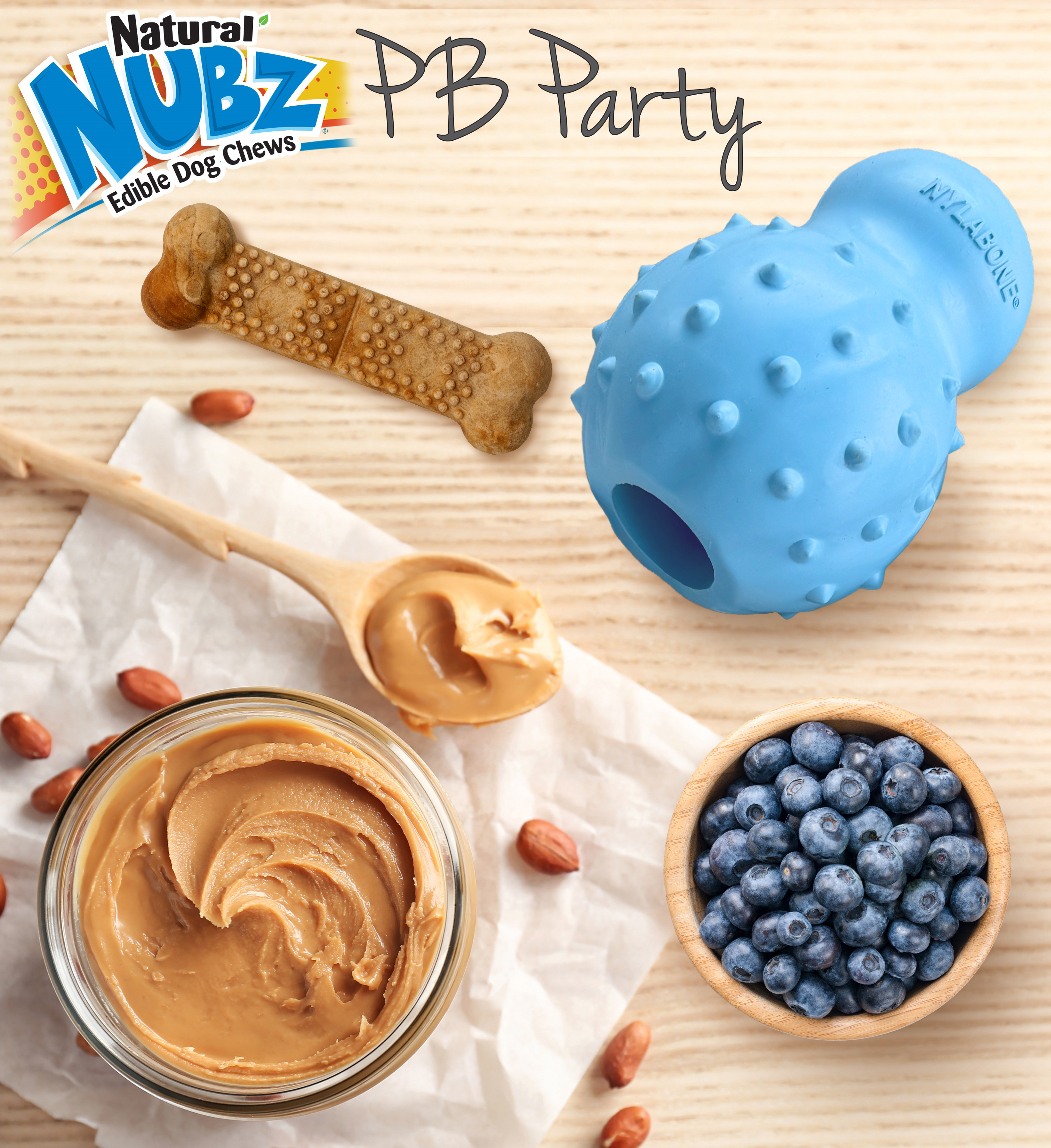 Nubz Peanut Butter Party with chew treat, peanut butter, blueberries, and stuffable chew toy.