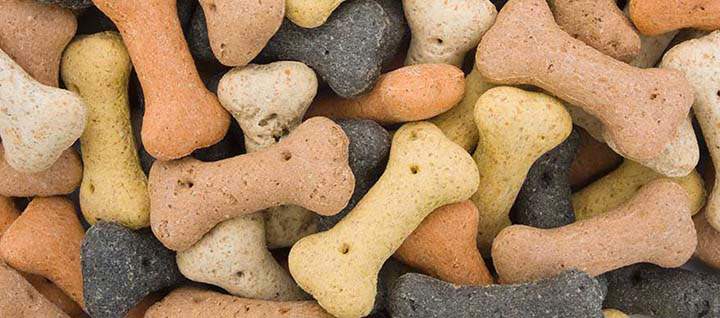 A pile of dog treats in a variety of colors and flavors.
