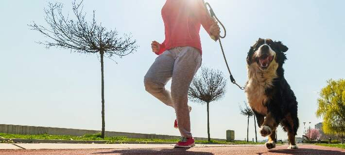 woman running with dog