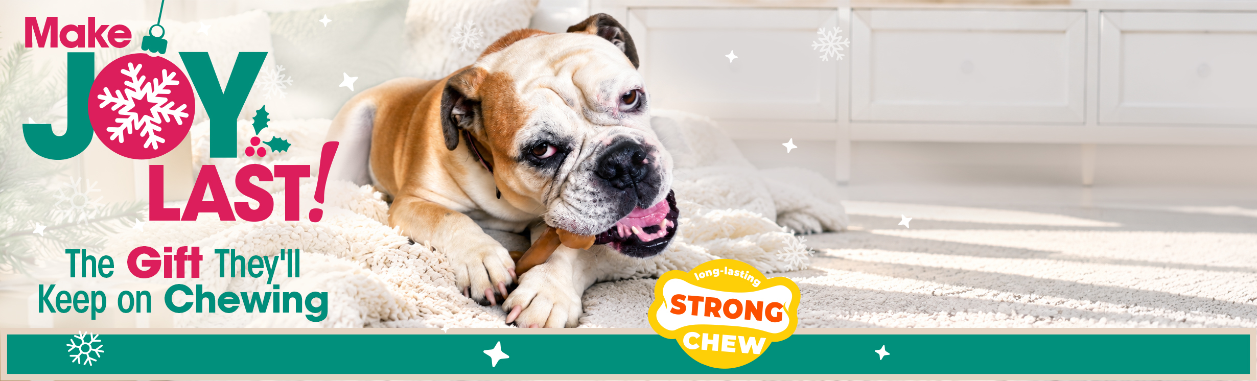 Nylabone Long-Lasting Strong Chew toy. Make Joy Last! A bulldog chews a brown chew toy on a plush white blanket
